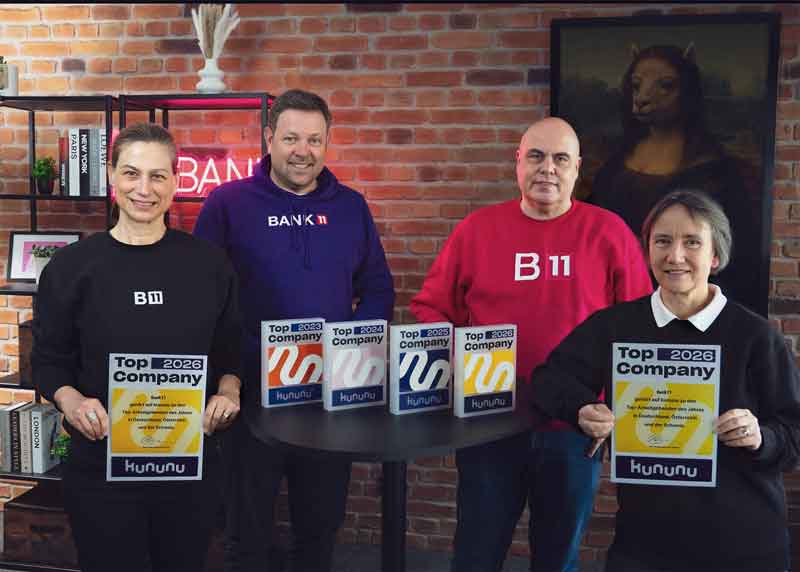 Teamfoto von Bank11 mit kununu-Siegel ›Top Company 2026‹.